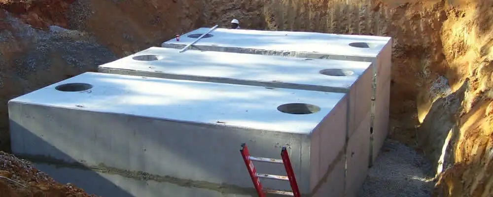 Septic tank installation site with a newly placed concrete tank in San Mateo, CA